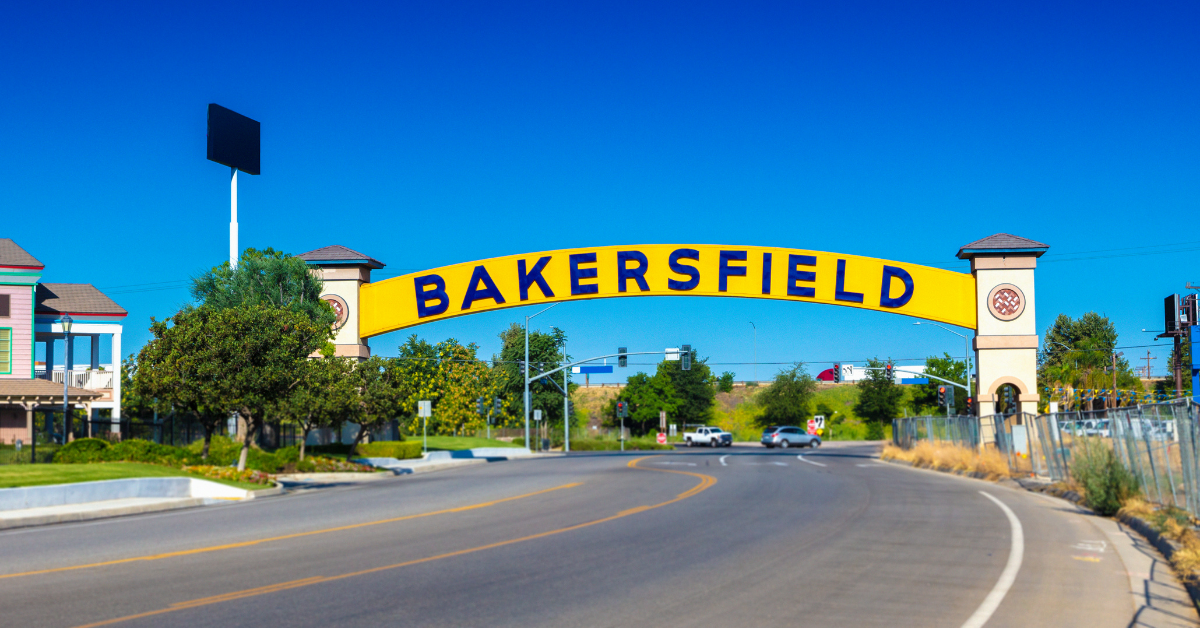 Welcome sign to Bakersfield - Riverdale Village